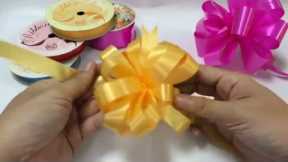 HOW TO MAKE AN EASY GIFT RIBBON BOW STEP BY STEP POMPOM POM POM PON MUST WATCH
